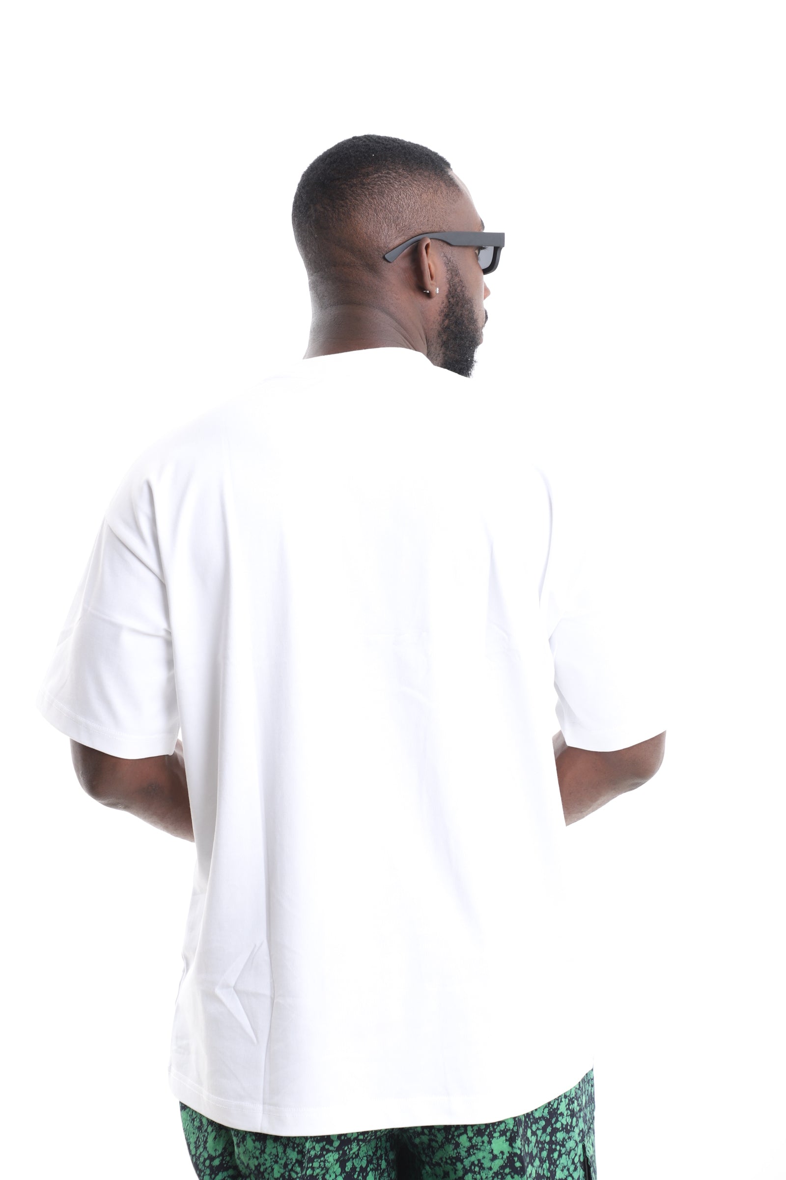 King Kaftan Cotton Oversized White T-Shirt with Emerald Splatter Adire Pocket Accent – Back View – African men's fashion Nigeria
