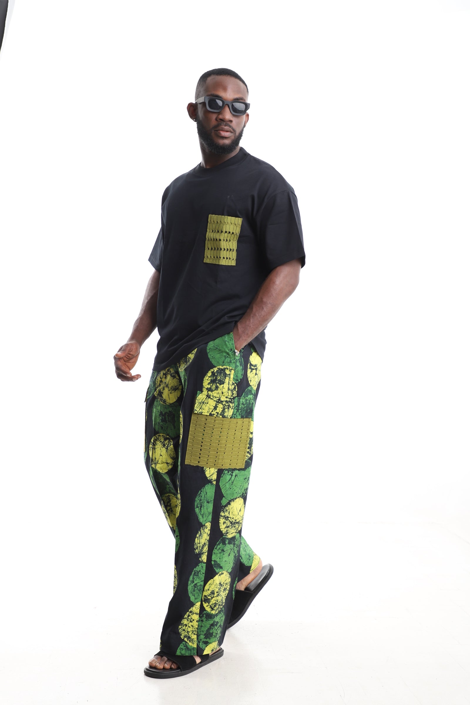 King Kaftan Circular Adire Cargo Pants Set with Oversized Black T-Shirt – Olive Mesh Pocket Detail – African men's fashion Nigeria