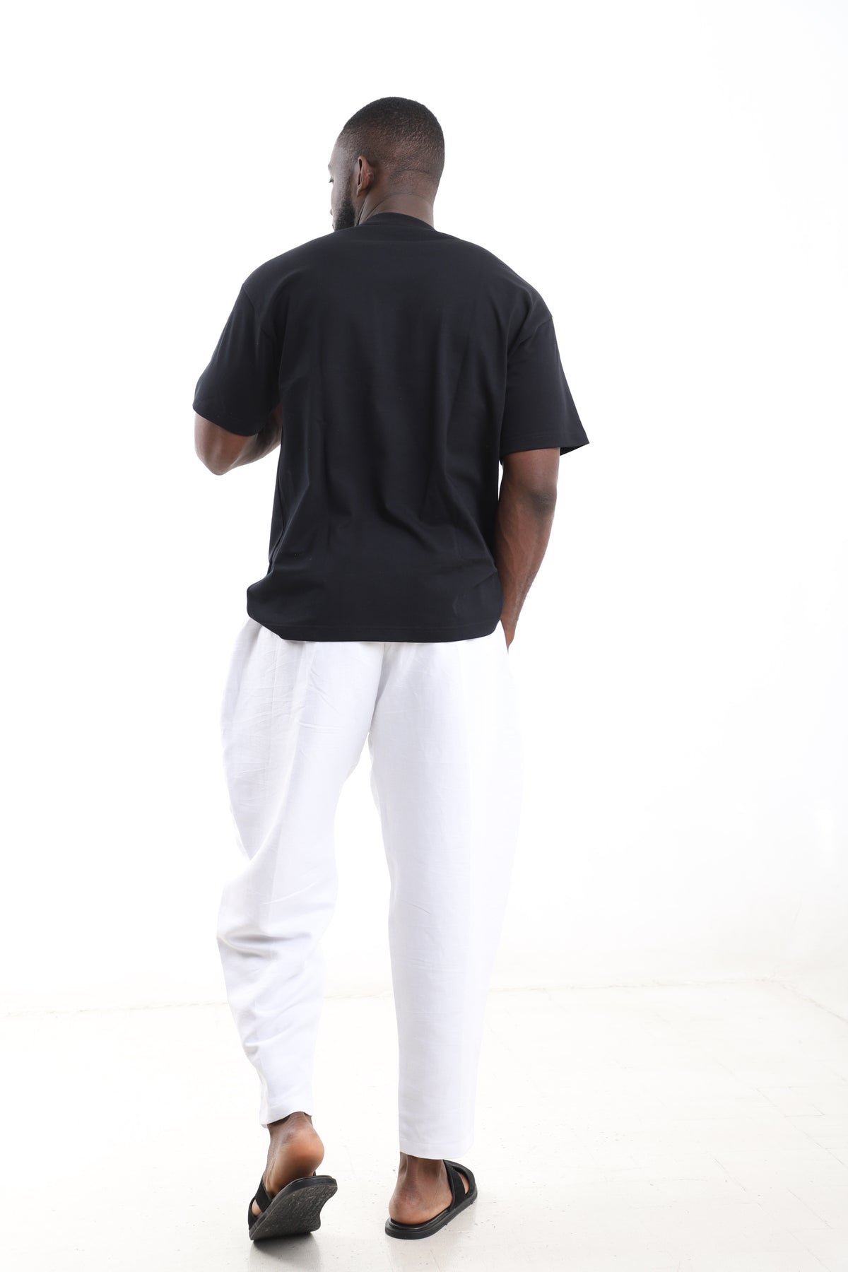 King Kaftan Block Patchwork T-Shirt and White Linen Pants Set – Back View – African men's fashion Nigeria
