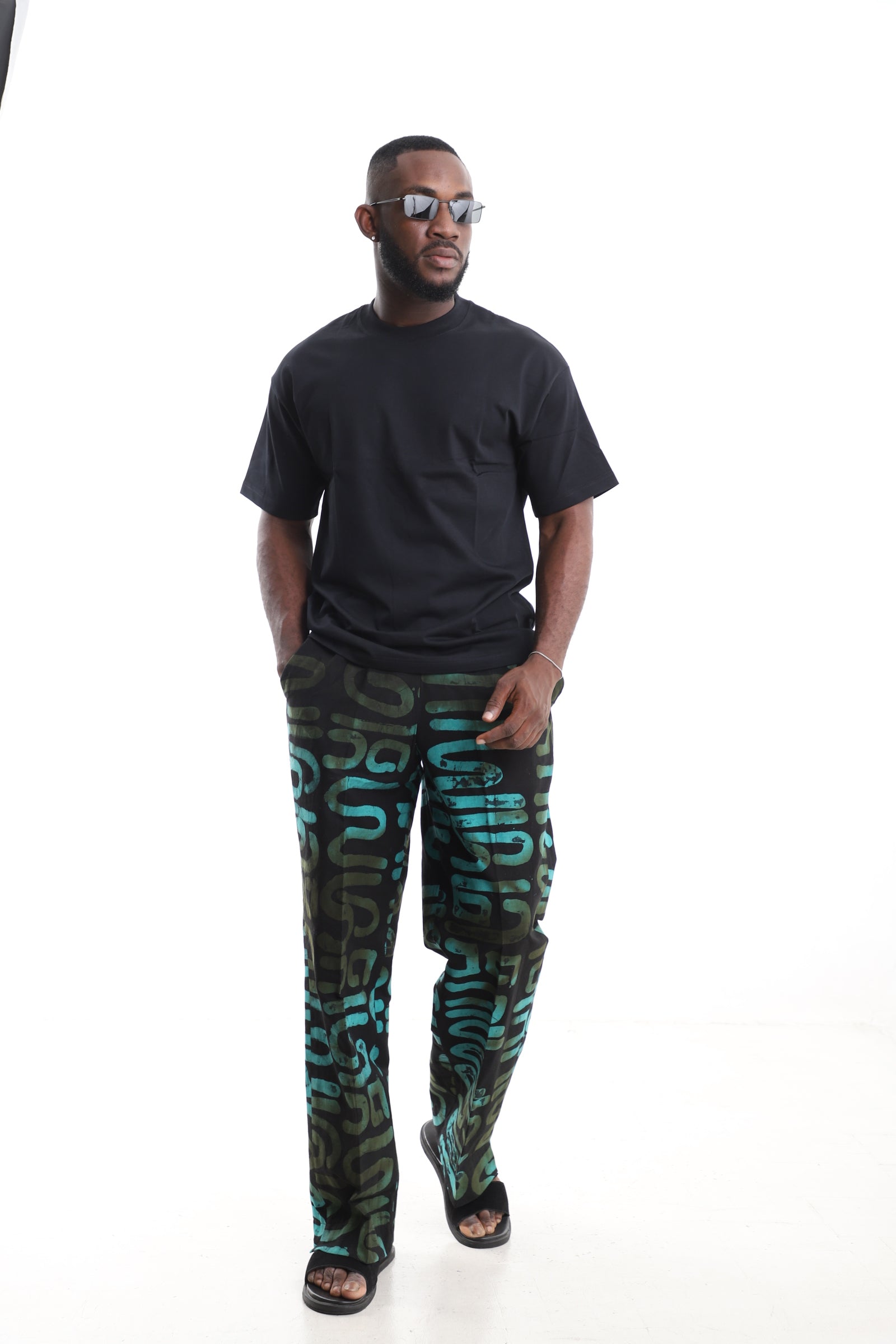 King Kaftan Black and Turquoise Calligraphy Adire Cargo Pants Set with Oversized Black T-Shirt – Front View – African men's fashion Nigeria