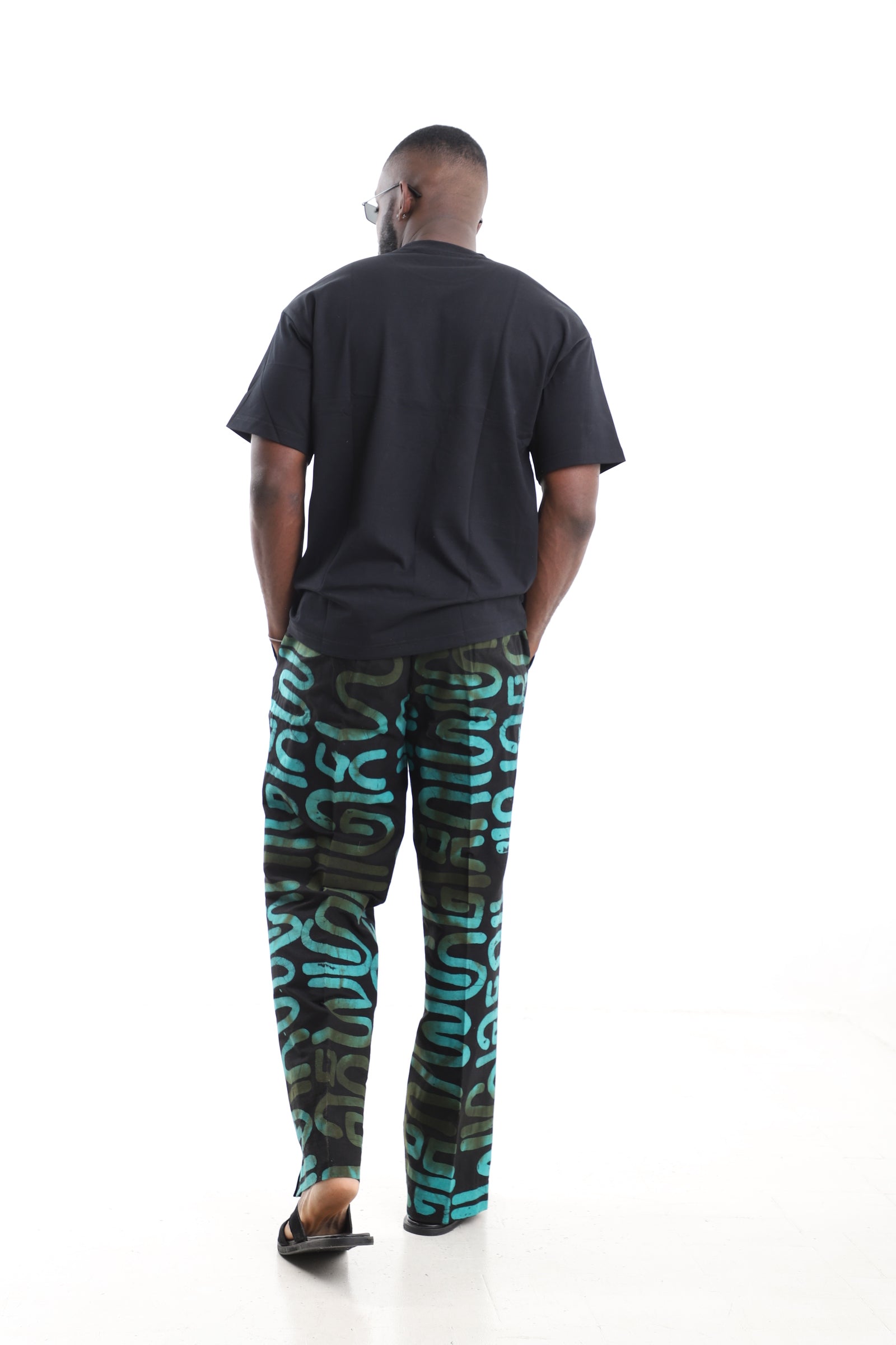 King Kaftan Black and Turquoise Calligraphy Adire Cargo Pants Set with Oversized Black T-Shirt – Back View – African men's fashion Nigeria