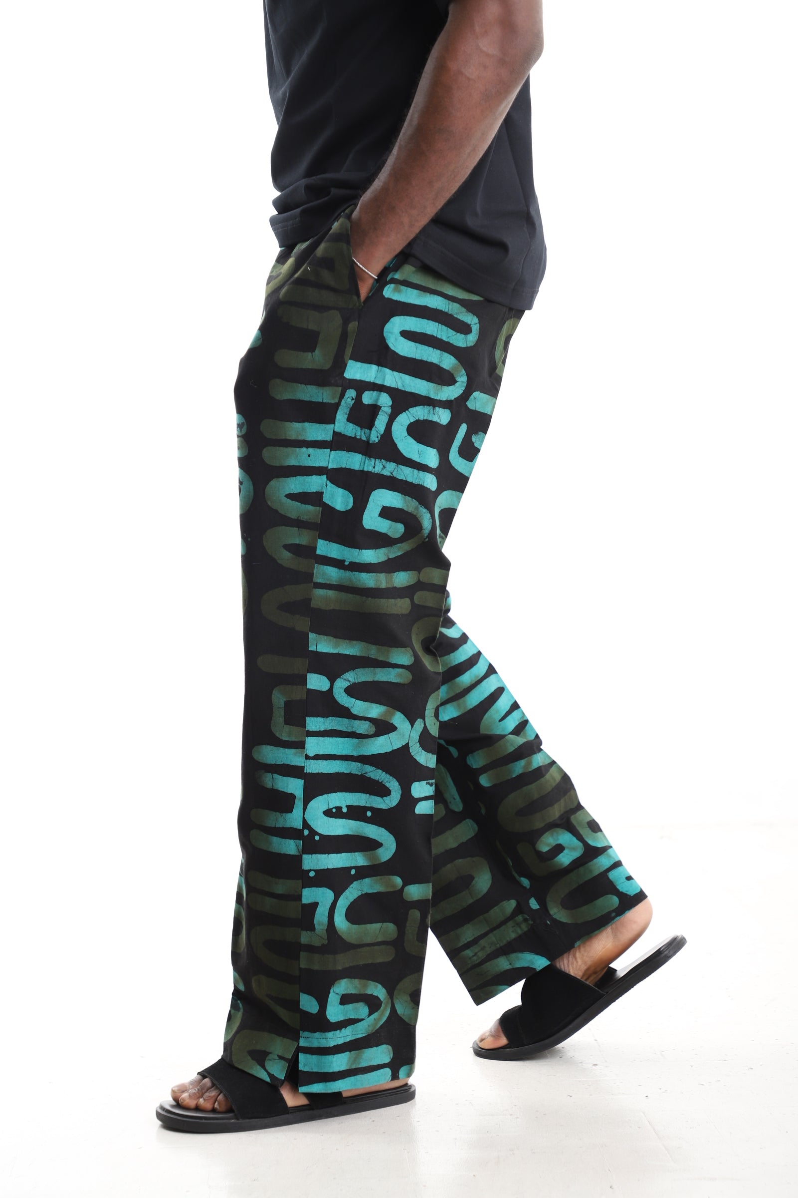 King Kaftan Black and Turquoise Abstract Calligraphy Adire Cargo Pants – Side View – African men's fashion Nigeria