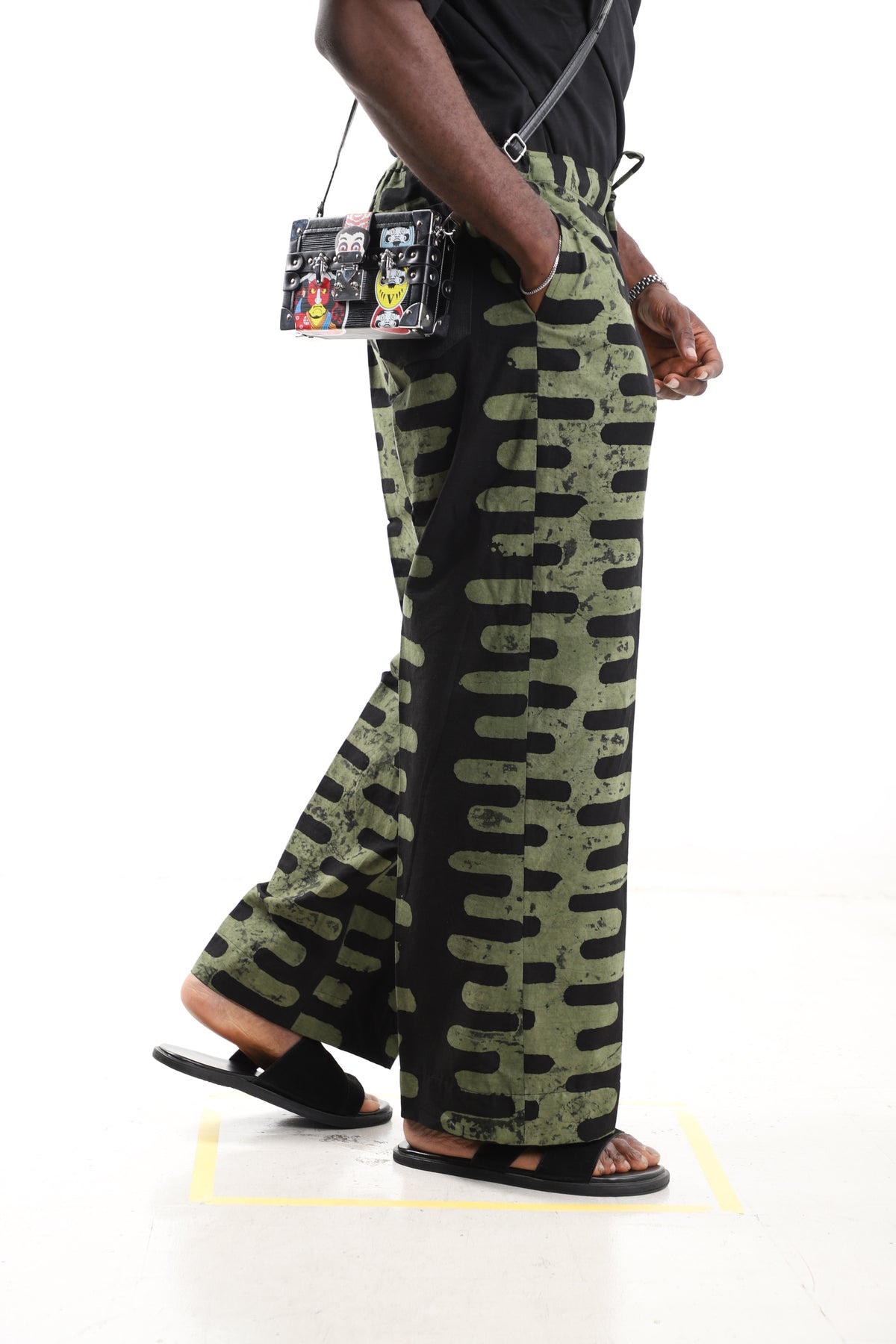 King Kaftan Vertical Stripe Batik Cotton Olive & Black Adire Pants – Side View – African men's fashion Nigeria